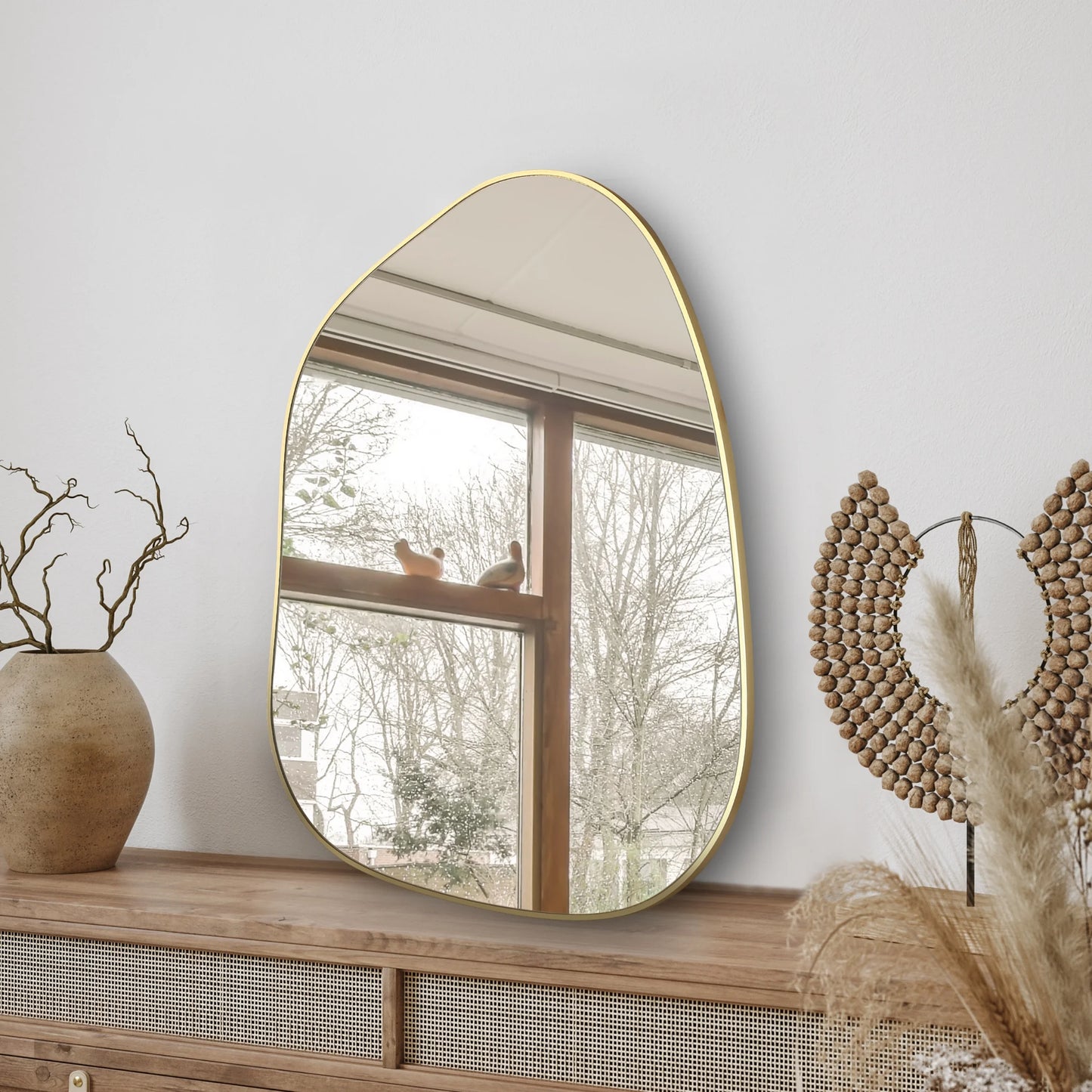 Asymmetrical Wall Mirror with Golden Wood Frame styled for a cozy modern home