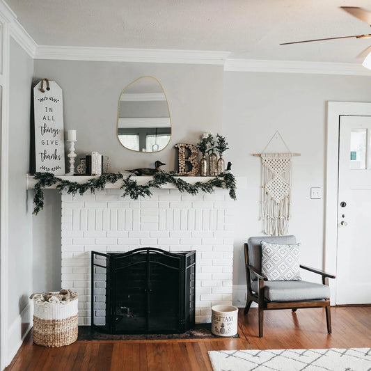 Asymmetrical Wall Mirror with Golden Wood Frame styled for a cozy modern home